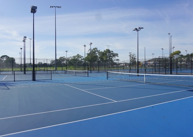 Looking across the blue courts of the Tennis Centre.