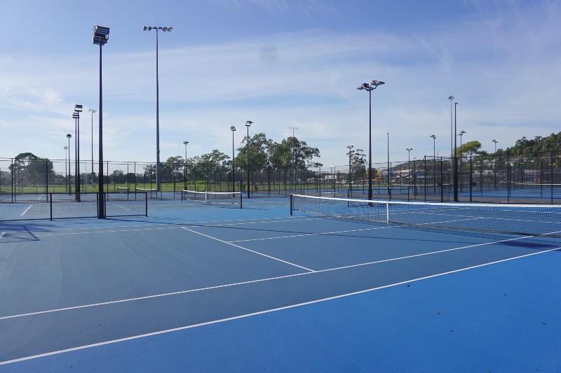 Looking across the blue courts of the Tennis Centre.